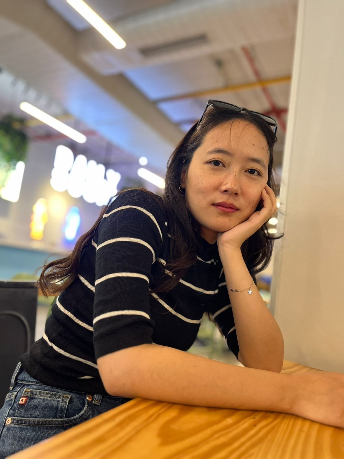 A woman sitting in a restaurant